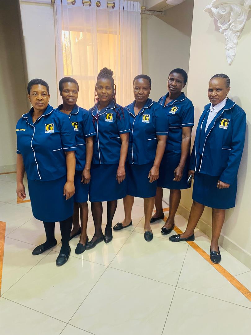 Greys Inn team members together in blue and gold uniforms