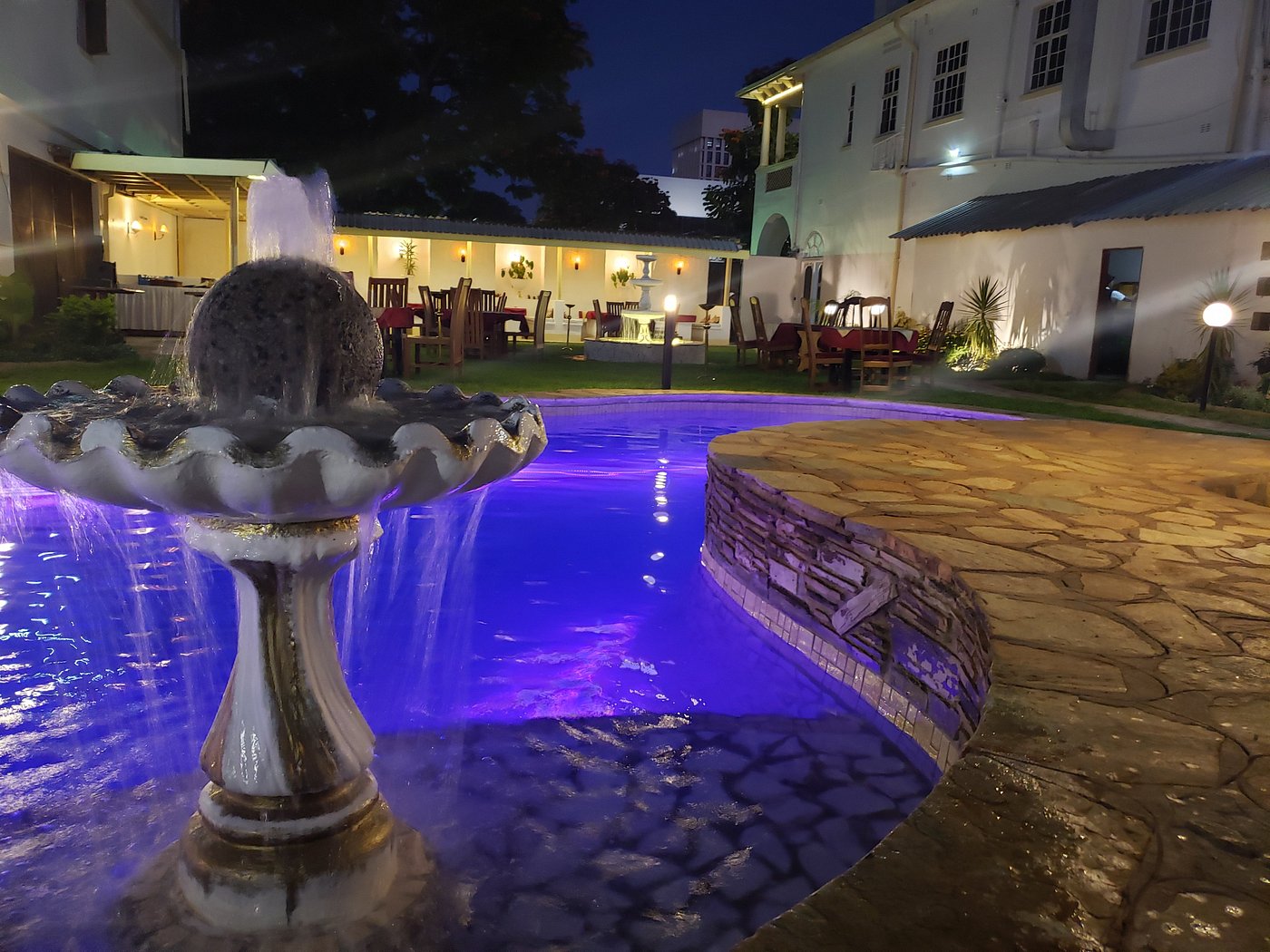 Illuminated pool and fountain in Selborne gardens